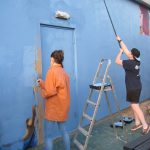 The Freefall youth group bluewash the Phoenix graffiti wall